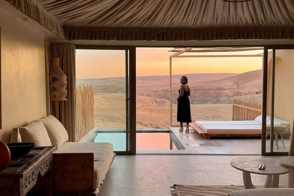 Furnished balcony overlooking the Agafay desert landscape at sunset